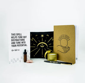 The full Focus Pocus set featuring a notebook with an image of a hand holding a glowing orb on the cover.