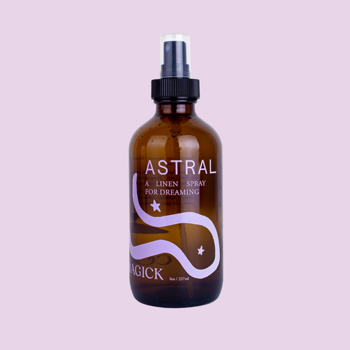 Astral: A Linen Spray for dreaming, in an amber glass bottle intentionally adorned with a minimalist swirling purple galaxy. 