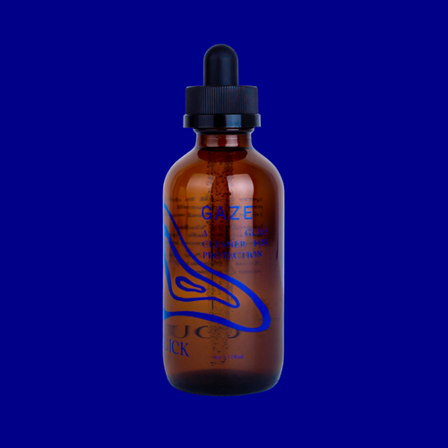 Gaze: A glass cleaner for protection, in an amber glass bottle intentionally adorned with minimalist navy blue swirls. 4 oz/118 mL.
